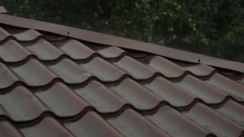 Heavy Rain Pouring Down on Red Metallic Roof of House. Gutter During Rainy .. Video stock 330124555