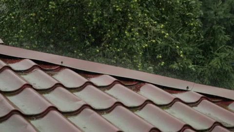 Heavy Rain Pouring Down on Red Metallic Roof of House. Gutter During Rainy .. Video stock 330124747