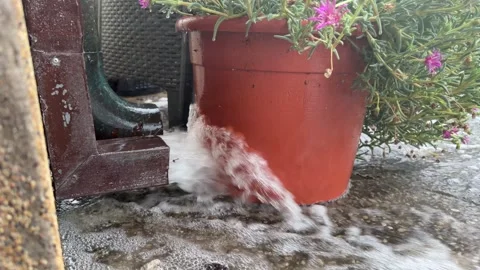 Heavy rain pouring from gutter downspout during storm Stock Footage 345828021