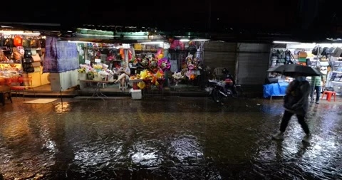 Heavy rain pouring at night, so the Petaling street is empty, panning view Stock Footage 319637017
