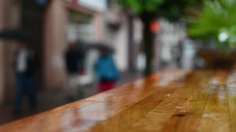 Heavy Rain Pouring Over Tables Of A Street Cafe In The City Center Vídeo Stock 341590873