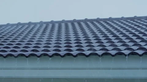 Heavy rain pouring over a tiled roof. Stock Footage 331280980