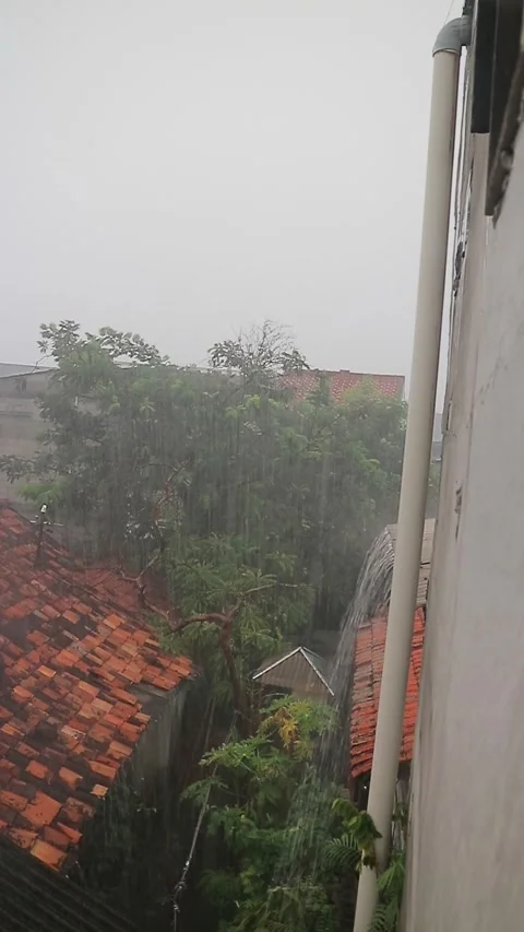 Heavy Rain Pouring from Rooftop Gutter Stock Footage 306440043