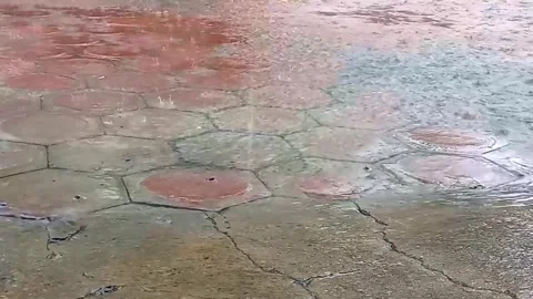 Heavy rain. Puddles formed by rainfall. Rain happens by changes in the weathe Stock Footage 267718952
