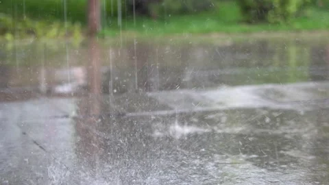 Heavy rain, raindrops falling, splashing on the ground Stock Footage 154445283