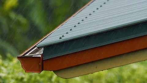 Heavy Rain Rooftop to Gutter Close Up, 4K Stock Footage 100997006