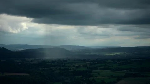 A heavy rain shower passing through the Shropshire countryside in England 스톡 동영상 346638521