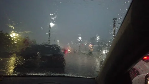 Heavy rain sitting in car seeing beach from beach road Vizag Stock Footage 138491902