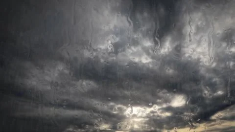 Heavy rain on sky with clouds - pretty weather backdrop - photo of nature Stock Photos