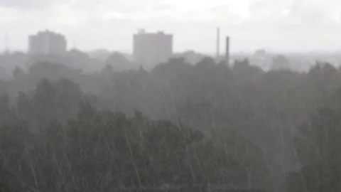 Heavy rain - soft focus cityscape on rainy summer day. Stock Footage