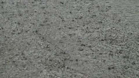 Heavy rain splashes on the asphalt road Stock Footage 323150706