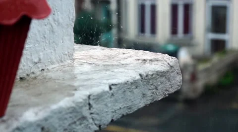 Heavy rain splashes on Window ledge above suburban street Stock Footage 40724840