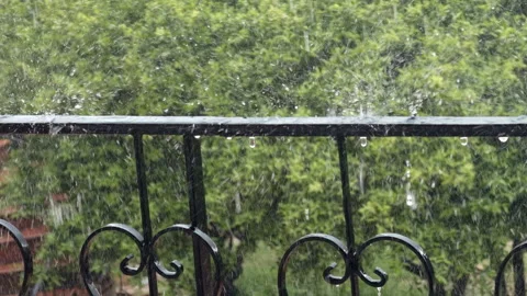 Heavy Rain Splashing on Balcony Railing Stock Footage 332483893