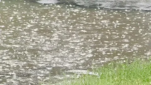 Heavy Rain Splashing Into Puddle Close Up Storm Weather Background. Stock Footage 334784559