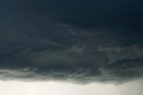 Heavy rain storm clouds, thunderstorm dramatic sky, bad day weather backgroun Stock Photos