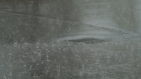 Heavy rain into a storm drain.  Stock Footage 105800952