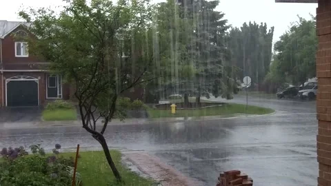 Heavy rain in the suburbs - 2 vans drive by 4K Stock Footage 133194587
