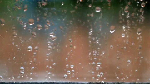 A heavy rain in summer seen through the windowpane Stock Footage 108264862