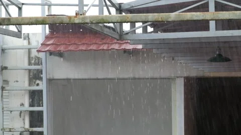 Heavy rain on the terrace of a building Stock Footage 291553208