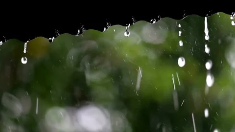 Heavy rain thunderstorm water dripping from roof of a house in day time. Stock-Footage 336570975