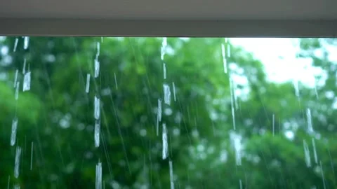 Heavy rain thunderstorm water dripping from roof of a house in day time. Stock Footage 336571040