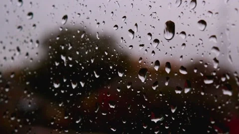 Heavy rain water drop stream down on glass window in detailed close up downpour Stock Footage 163186262