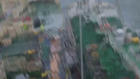 Heavy rain water falls down camera focusing on tankers Stock Footage 135443427