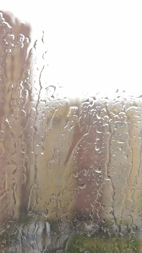Heavy Rain Water Streaming Down Glass Window City View Stock Footage 346399226
