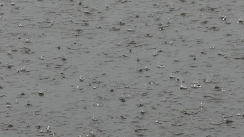 Heavy rain on water surface Видео 120639173