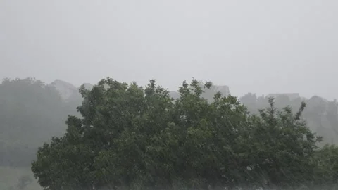 Heavy rain with wind falling on the metal factory roof Stock Footage 196996062