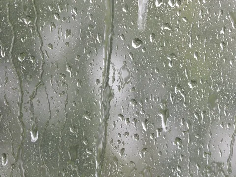 Heavy rain on window running water drops and splashes Stock Footage 80875778