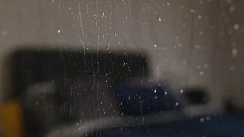 Heavy Rain on window in a winter holiday night Stock Footage 225072914