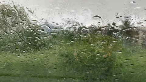 Heavy Rain on the windshield of a car on a rainy day Video stock 162980009
