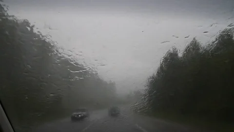 Heavy rain. Windshield. Inside the car. Work "wipers". Stock-Footage 70669548