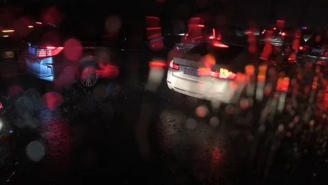 Heavy raindrops fall on car window on the highway Stock Footage 115879052
