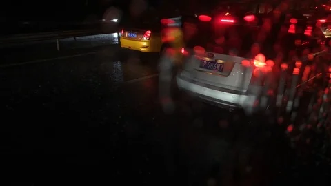 Heavy raindrops fall on car window on the highway Stock Footage 115894138