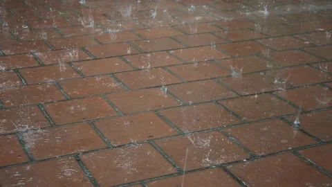 Heavy raindrops with hail fall on the paving slabs. Stock-Footage 243254525
