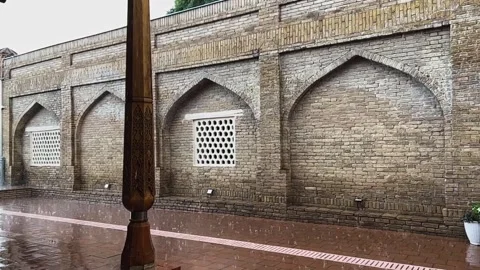 Heavy raindrops with hail fall on the paving slabs. Slow motion video. Stock-Footage 248382283