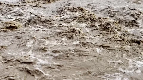 Heavy Rainfall Causing Flooded Stream with Muddy Water Stock-Footage 339779154
