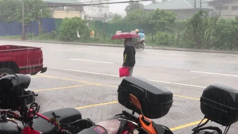 Heavy Rainfall. Mac Arthur Highway, Bulacan, Philippines. Road with cars people Stock Footage 158618696