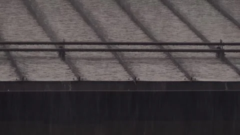 Heavy Rainfall: Water Cascading Over Building Roof Stock Footage 310328427