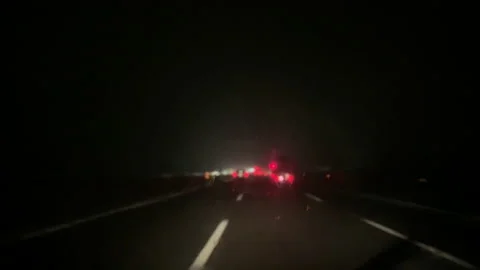 Heavy rainfall while driving in a car at night. Vídeo Stock 142064451