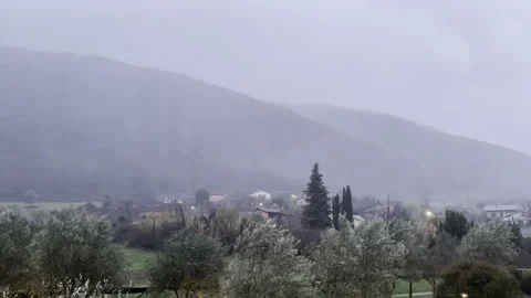 Heavy raining in mountains, storm clouds covering mountains peaks and hills with Stock Footage 269220543