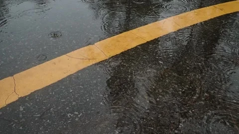 Heavy raining slow motion drop on asphalt road. Stock Footage 157270944