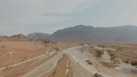 Heavy rains on the top of the green mountain led to the flow of the Nizwa Stock Footage 106921799