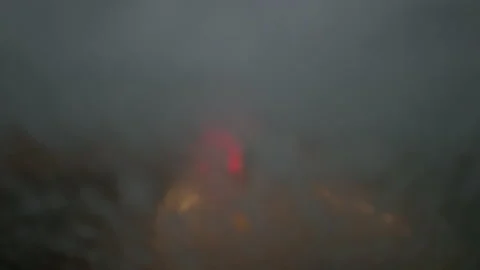 Heavy rains on the windshield while driving in a car at night. Vídeo Stock 141183152