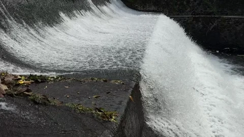 Heavy River Flows from Three Level Dam with Clean Water Stock Footage 267718884