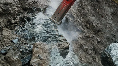 Heavy Rock Drilling Machine in Action, Breaking Rock and Stones Falling Stock-Footage 302218565