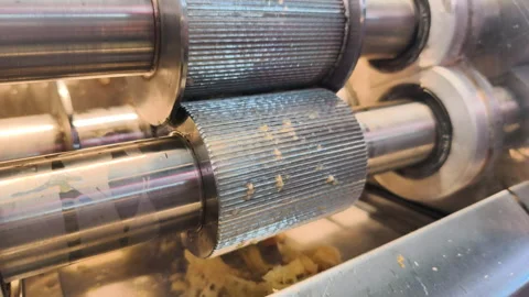 Heavy rollers efficiently handle beverage preparation. Fresh sugarcane juicing Stock Footage 322725813