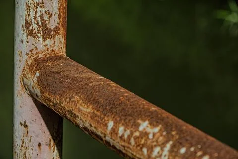 Heavy rust texture on horizontal industrial iron pipe near midnight Stock Photos